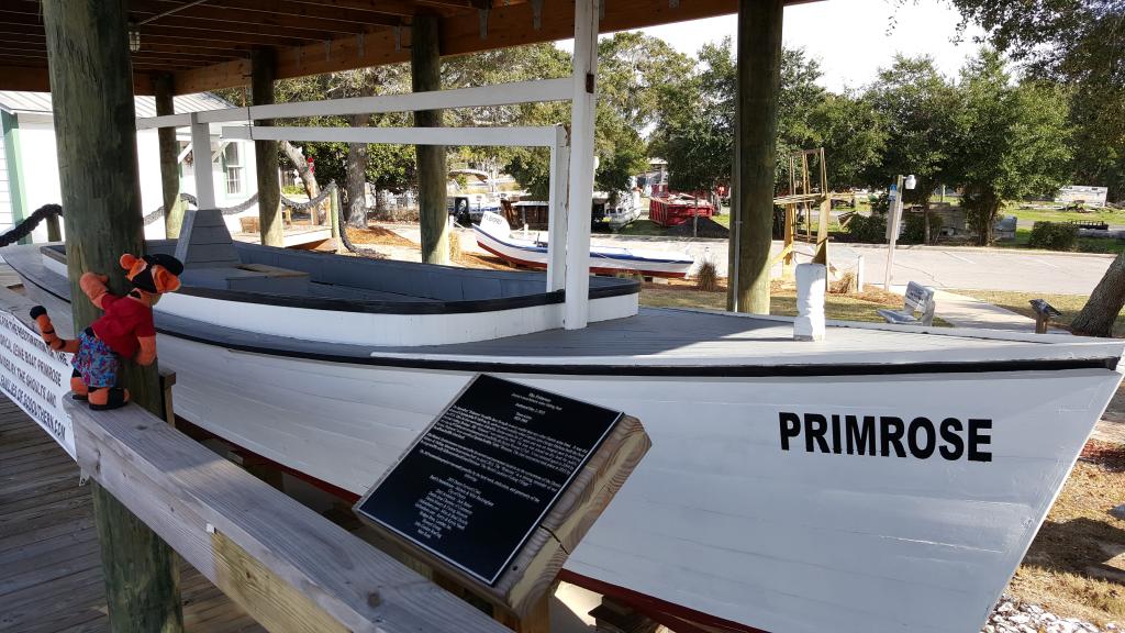 Click to enlarge image Tigger soaking up the tools used on the Primrose through the middle of the 1900s - The Primrose at the Destin History & Fishing Museum - Working Vessel of Captain John W. Melvin, A Wonderful Slice of Local Lore - The History that Built the World's Luckiest Fishing Village.