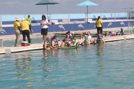 Click to enlarge image Standing on the platform in the water - Ever wonder what it is like to swim with a Dolphin? - Dolphin Discovery Grand Cayman