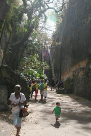 Click to enlarge image Looking back at the Queen`s Staircase from about halfway down the cut in the rocks. There are public restrooms just to the left out of frame. - The Queen`s Staircase - Escape Route from Fort Fincastle that still exists.