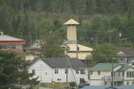 Click to enlarge image There is a Bald Eagle that is perched on top of that yellow tower that watched our ship pass. - Everyone should Cruise the Inside Passage - Part 2: One of the most impressive cruises ever, the coast of Alaska with take your breath away!!