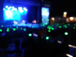 Click to enlarge image Intentionally blurry picture that better shows the green arm bands. During the concert they changed all colors! - #greenlightavet at Gary Sinise and the Lt. Dan Band - #greenlightavet at The Walmart AMP in Rogers, Arkansas