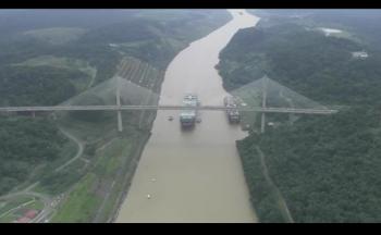 Click to enlarge image Cosco Shipping Panama passes under the Centential Bridge in the middle of the Panama Canal.. the first largest ship to pass through the new locks! — at Panama Canal. - Panama Canal Expansion Inauguration - June 26, 2016