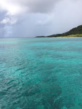 Click to enlarge image Here one can see the contrast between the rain above and the clear aquamarine water below! - TRC Boating in the British Virgin Islands - Part 5 of 5 - Even in stormy waters, Captain Taiwo demostrated his many resources to deliver us through safely!