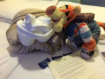 Click to enlarge image Tigger tries kissing the Towel and Blanket Frog to see if he gets a PRINCESS!! - Disney Cruise Line Towel Animals - Towel Critters are a nightly treat on all Disney Cruise Vacations