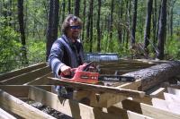 Click to enlarge image  - How to put a Round Log in a Square Hole - With a chainsaw!!!