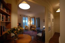 Click to enlarge image View from Kitchen into livingroom. Large bedroom entrance in background with seperate toilet and shower at the end of the hall to the right. - Renting an Apartment in Paris - Definitely THE way to go!!!