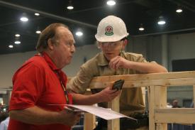 Click to enlarge image Val consulting with one of the judges on the project. - Val at the Skills USA competition - Arkansas competition